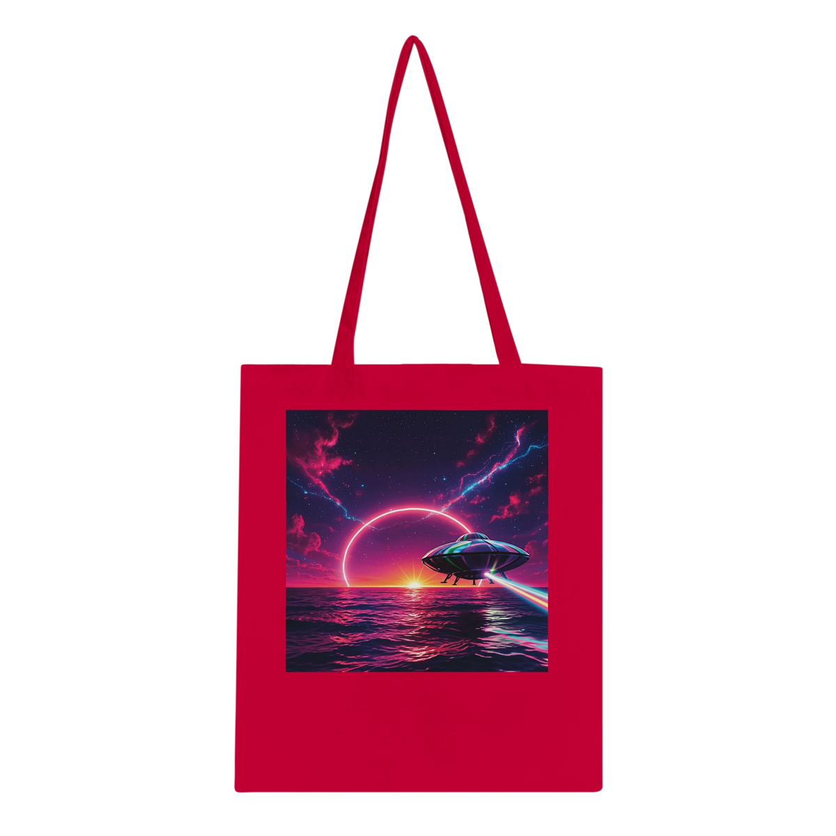 A bright red canvas tote bag with dual shoulder straps, featuring a large square graphic print on the front depicting a futuristic space scene with a flying saucer over a glowing ocean under a purple and pink sky.