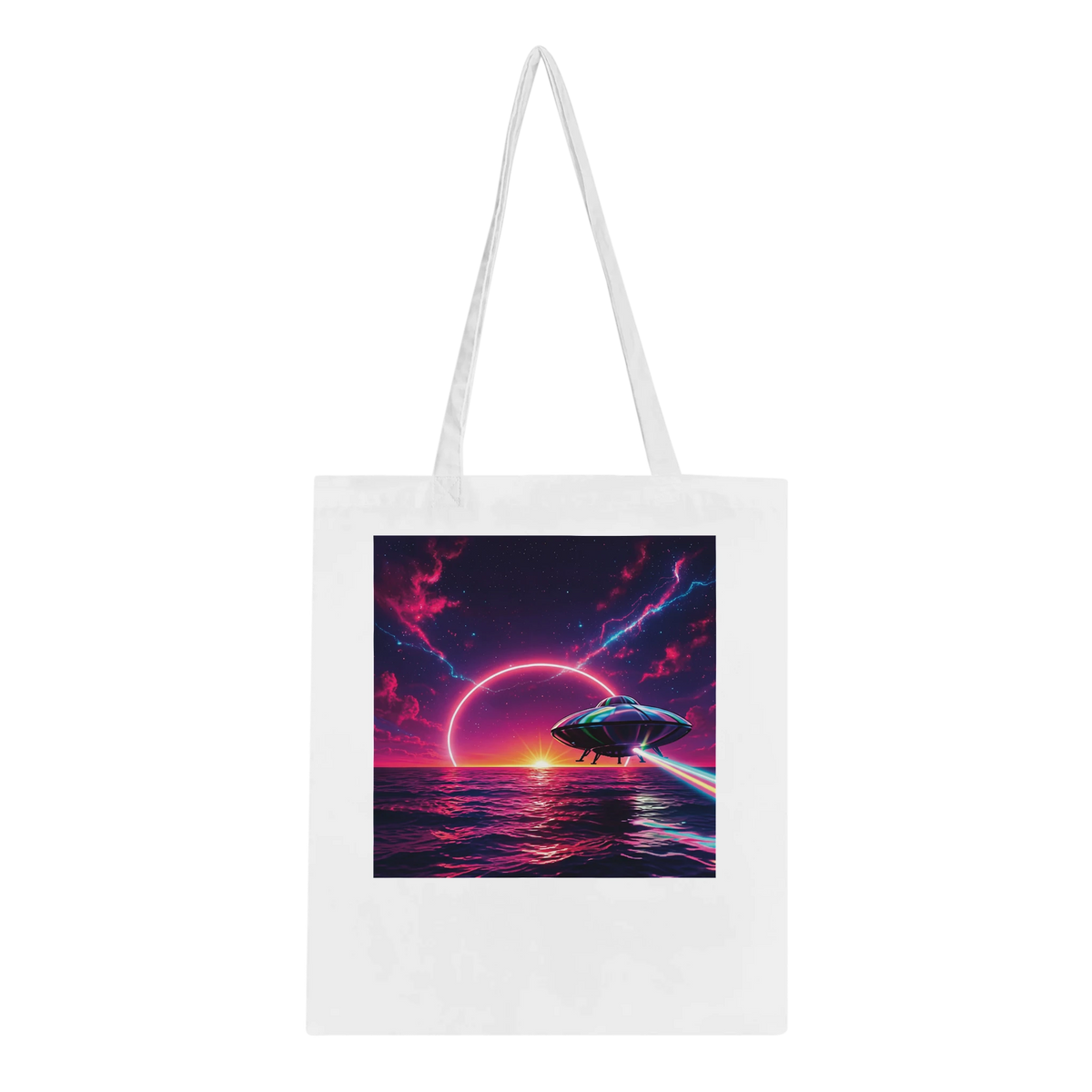 A bright white canvas tote bag with dual shoulder straps, featuring a large square graphic print on the front depicting a futuristic space scene with a flying saucer over a glowing ocean under a purple and pink sky.