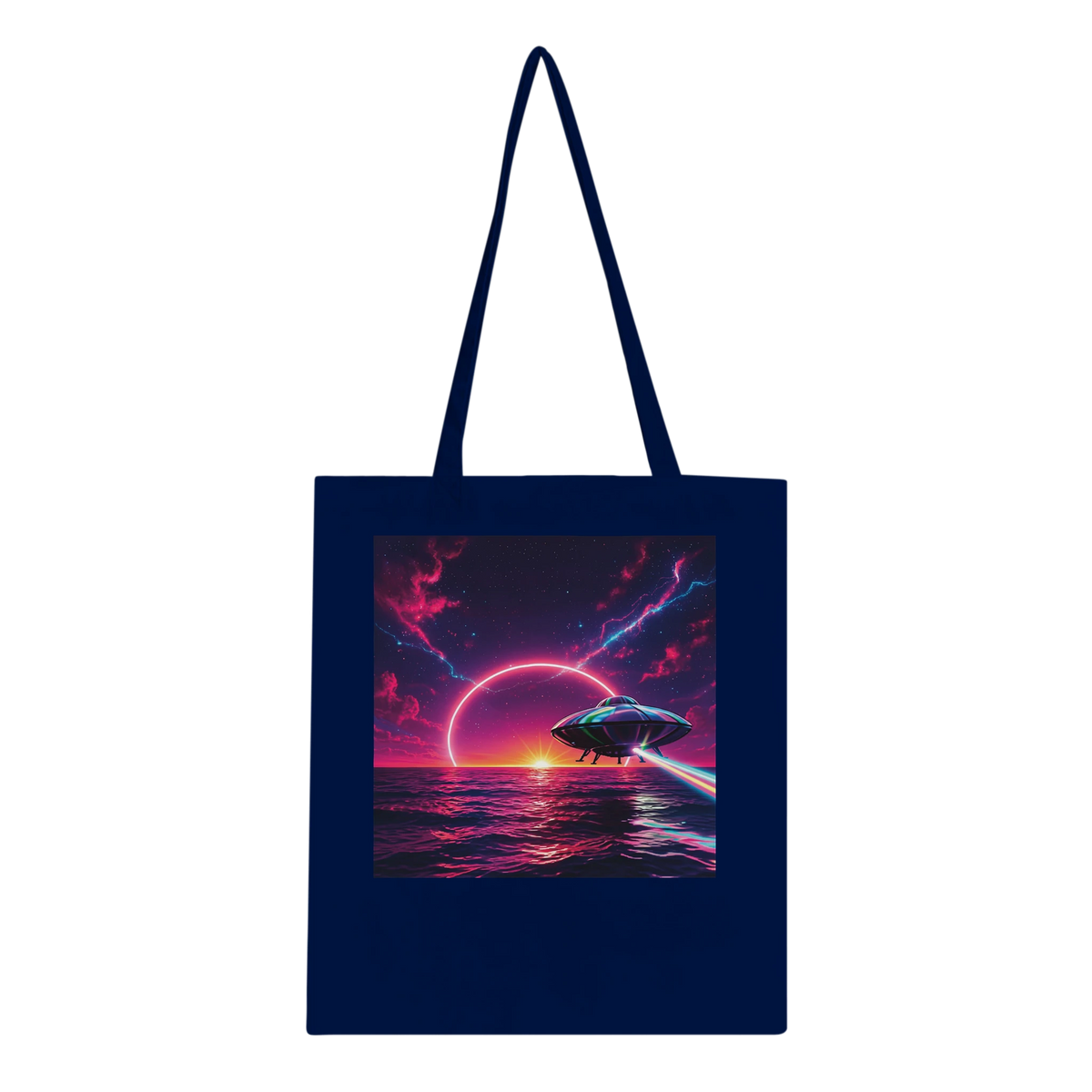 A navy blue canvas tote bag with long shoulder straps, featuring a large square graphic print on the front of a futuristic flying saucer over a neon pink and purple ocean under a dark sky.